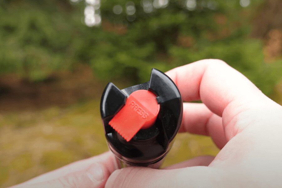 A defense spray button. Source: Rigad