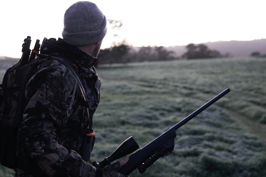 A hunter. Source: https://www.pexels.com/cs-cz/foto/krajina-muz-osoba-stromy-2954926/