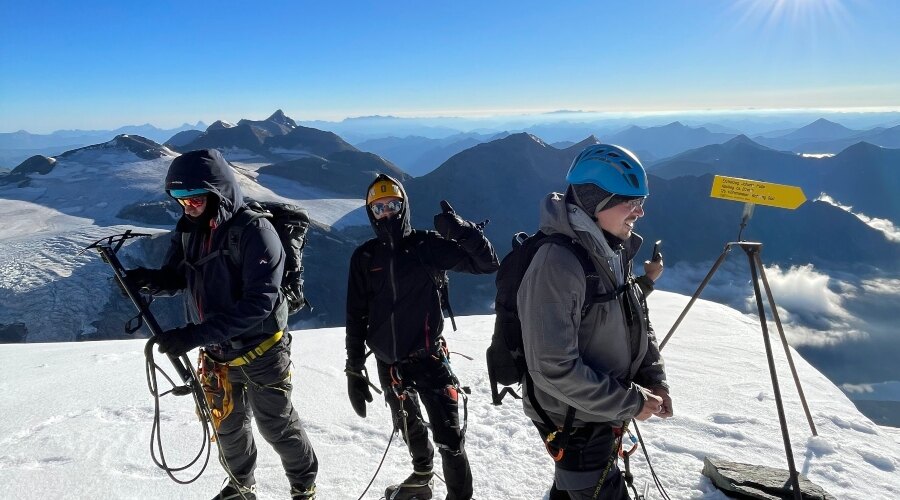 Group of people in the mountains in winter clothes