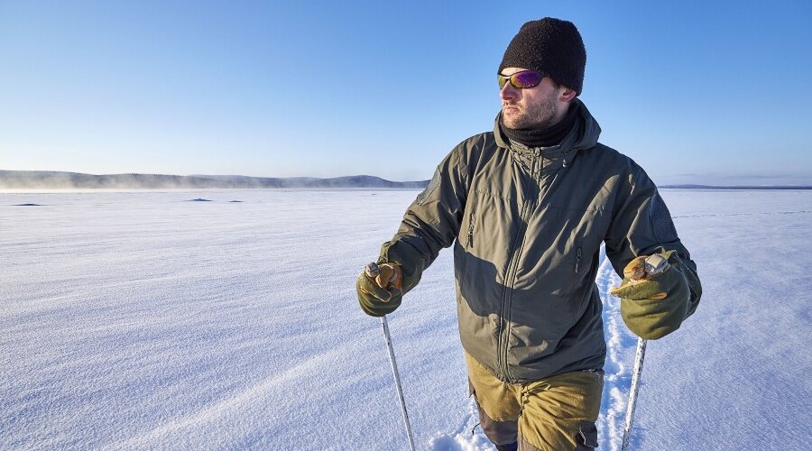 Man on cross-country skis in winter clothes