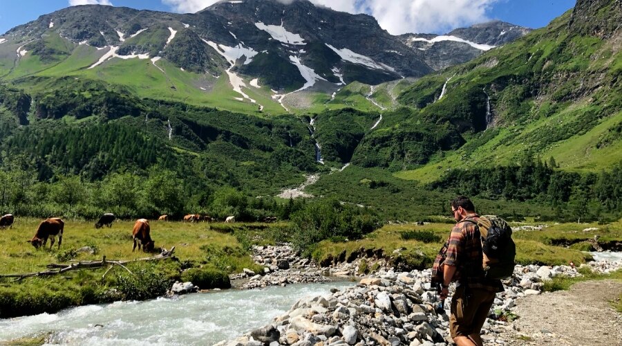 A man in the mountains by a river