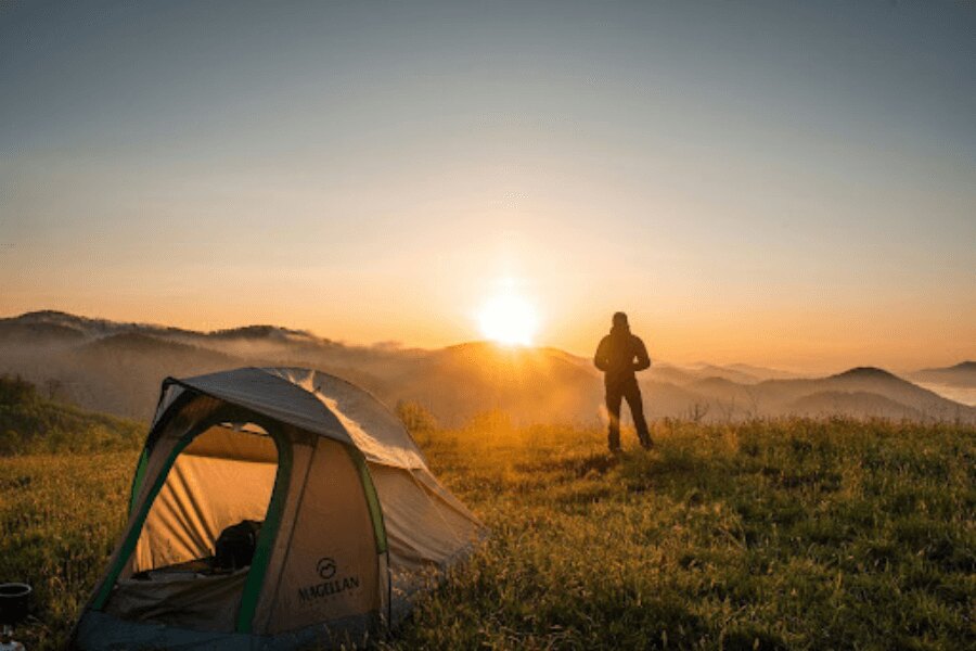 a tent, mountains