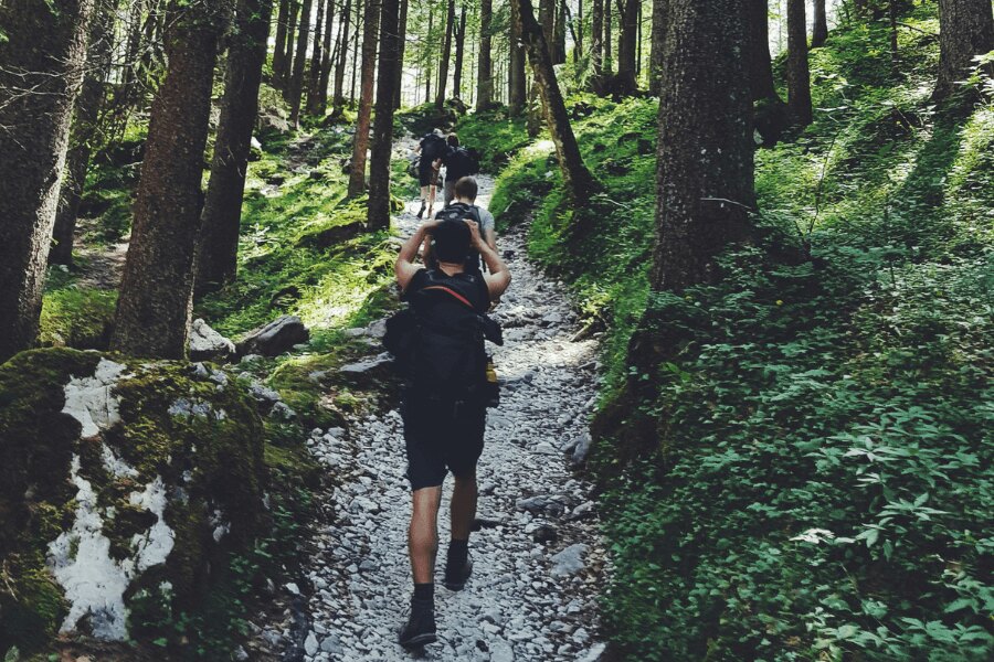 young people on a trail, speed hiking