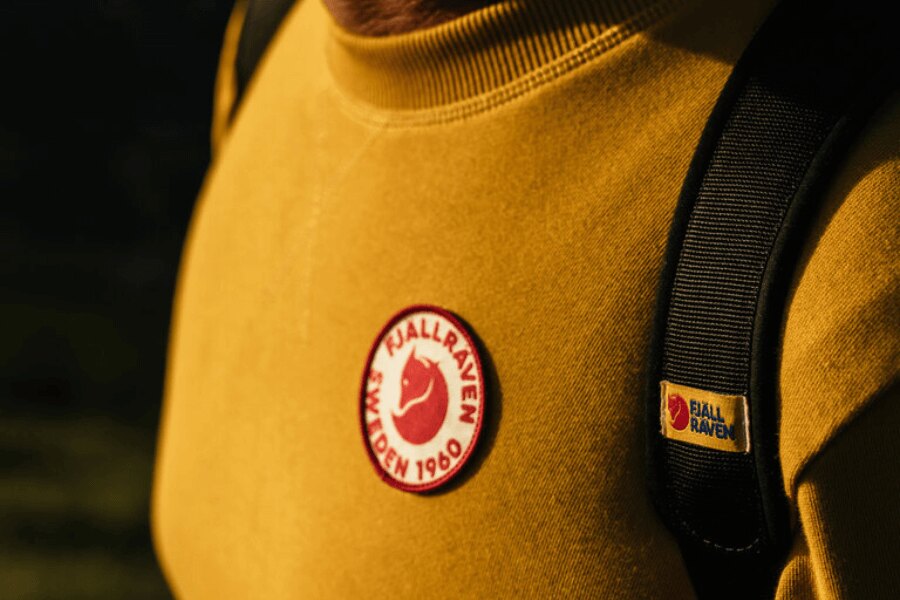 Fjällräven logo on a yellow sweatshirt. Source: Fjällräven, Rigad.cz