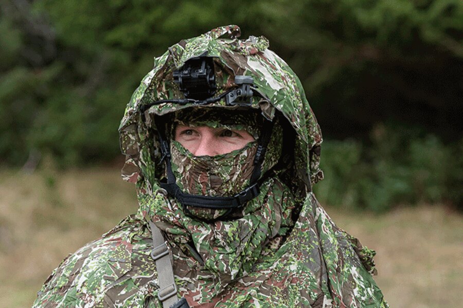 Ghosthood anti-drone poncho, CONCAMO pattern, with a helmet. Source: ghost-hood.com