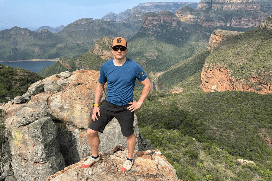 A man in the Rigad cap standing on a rock in the Drakenberg in Africa. Photo: Author's archive