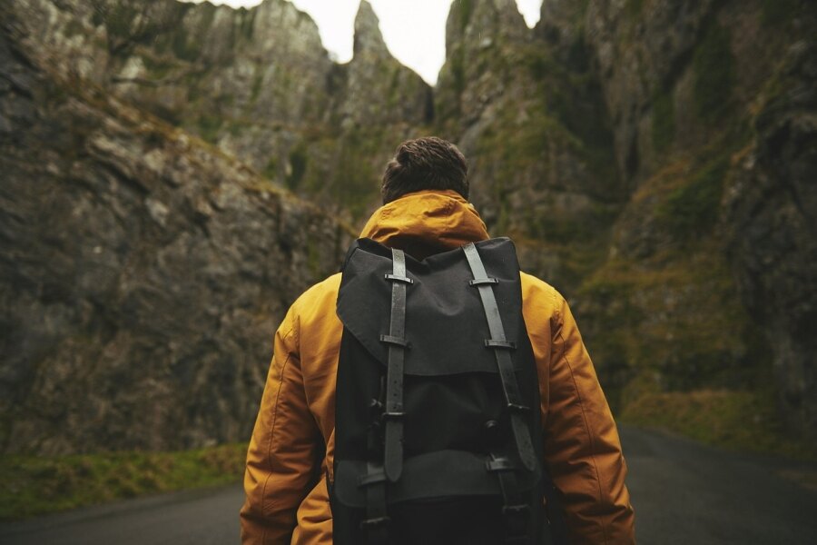 Man with a backpack among the rocks